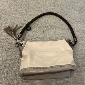 TheSak beige Purse with leather exterior! Used once with a teal pattern interior